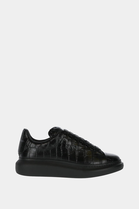 Alexander McQueen "Oversized" black calf leather low lop sneakers with embossed effect