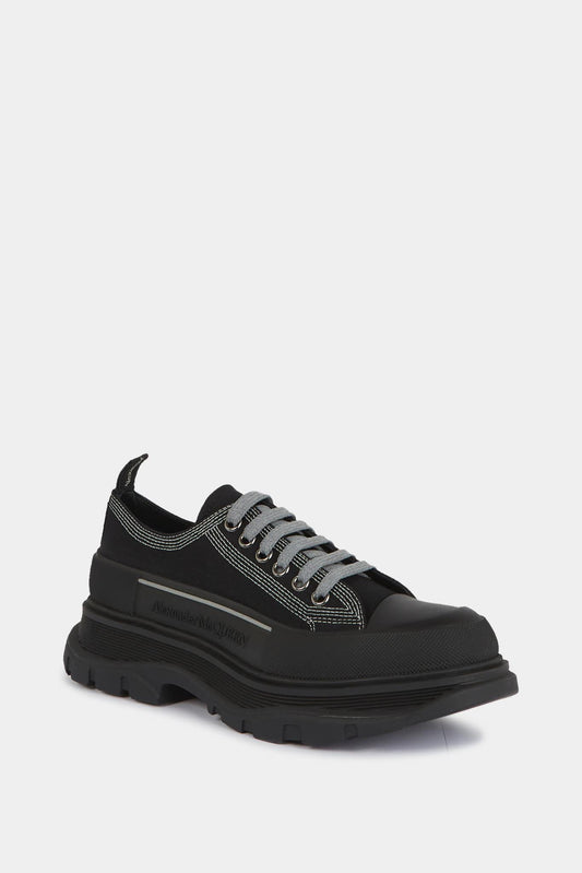 Alexander McQueen Basse sneakers "Tread Slick" in black canvas with contrasting lacing