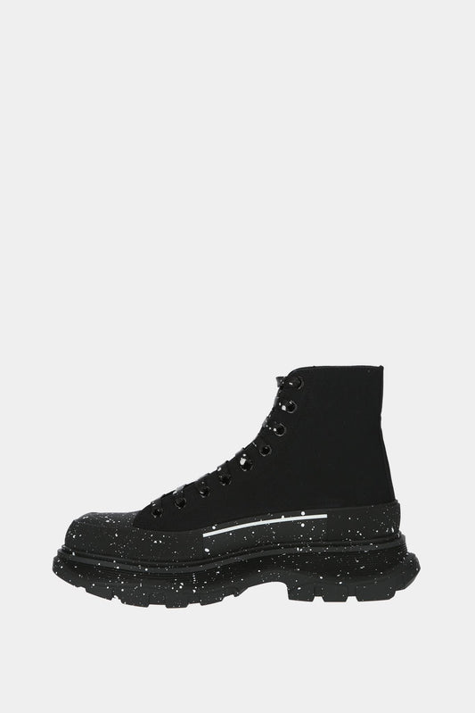 Alexander McQueen Baskets hautes "Tread Slick" noires avec tâches de peinture blanches - LECLAIREUR