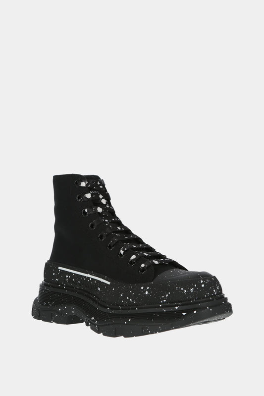 Black "Tread Slick" high top sneakers with white paint stains