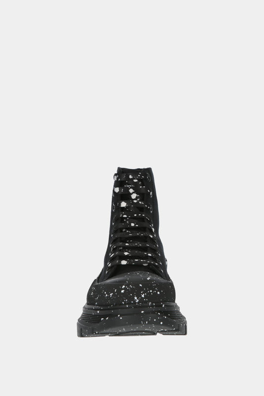 Alexander McQueen Baskets hautes "Tread Slick" noires avec tâches de peinture blanches - LECLAIREUR