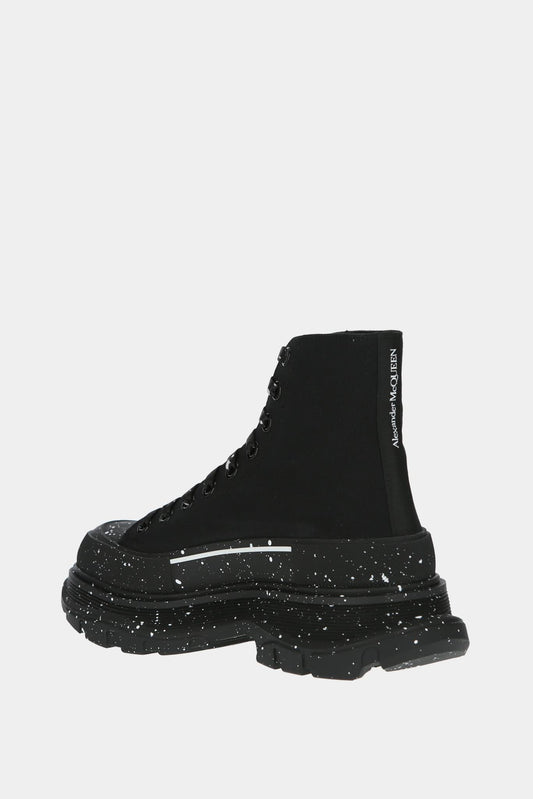 Alexander McQueen Baskets hautes "Tread Slick" noires avec tâches de peinture blanches - LECLAIREUR