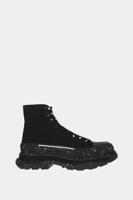 Black "Tread Slick" high top sneakers with white paint stains