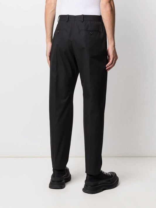 Alexander McQueen Pantalon à pince en coton noir - LECLAIREUR
