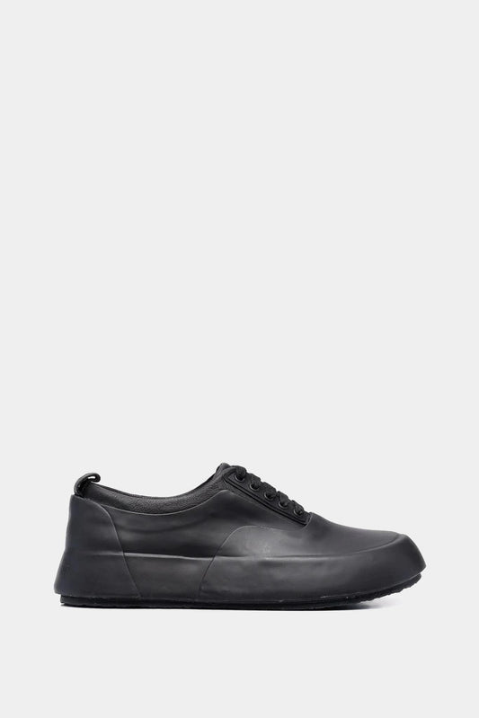 Black leather and rubber low-top sneakers