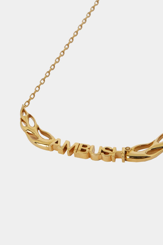 Golden necklace with logo and flames