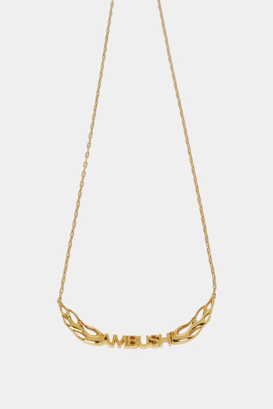 Golden necklace with logo and flames