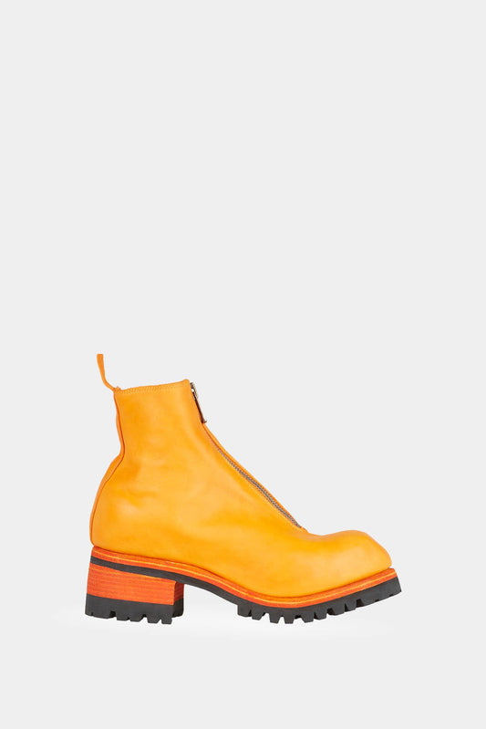 Orange leather boots with notched soles